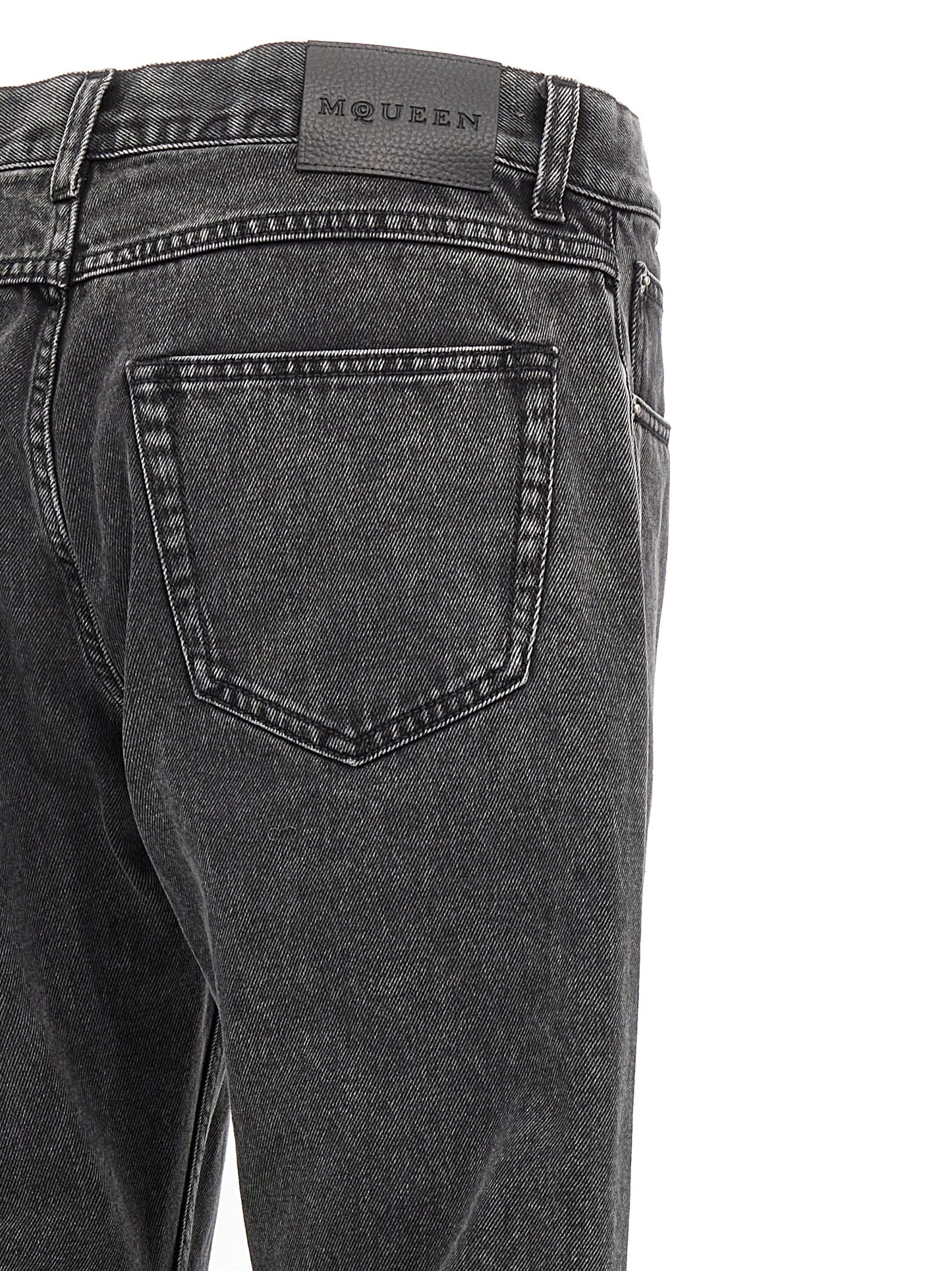 Jeans by Alexander McQueen for men in denim cotton black presents a tailored silhouette, showcasing a tailored straight-leg and long cut with a refined for a truly tailored aesthetic.