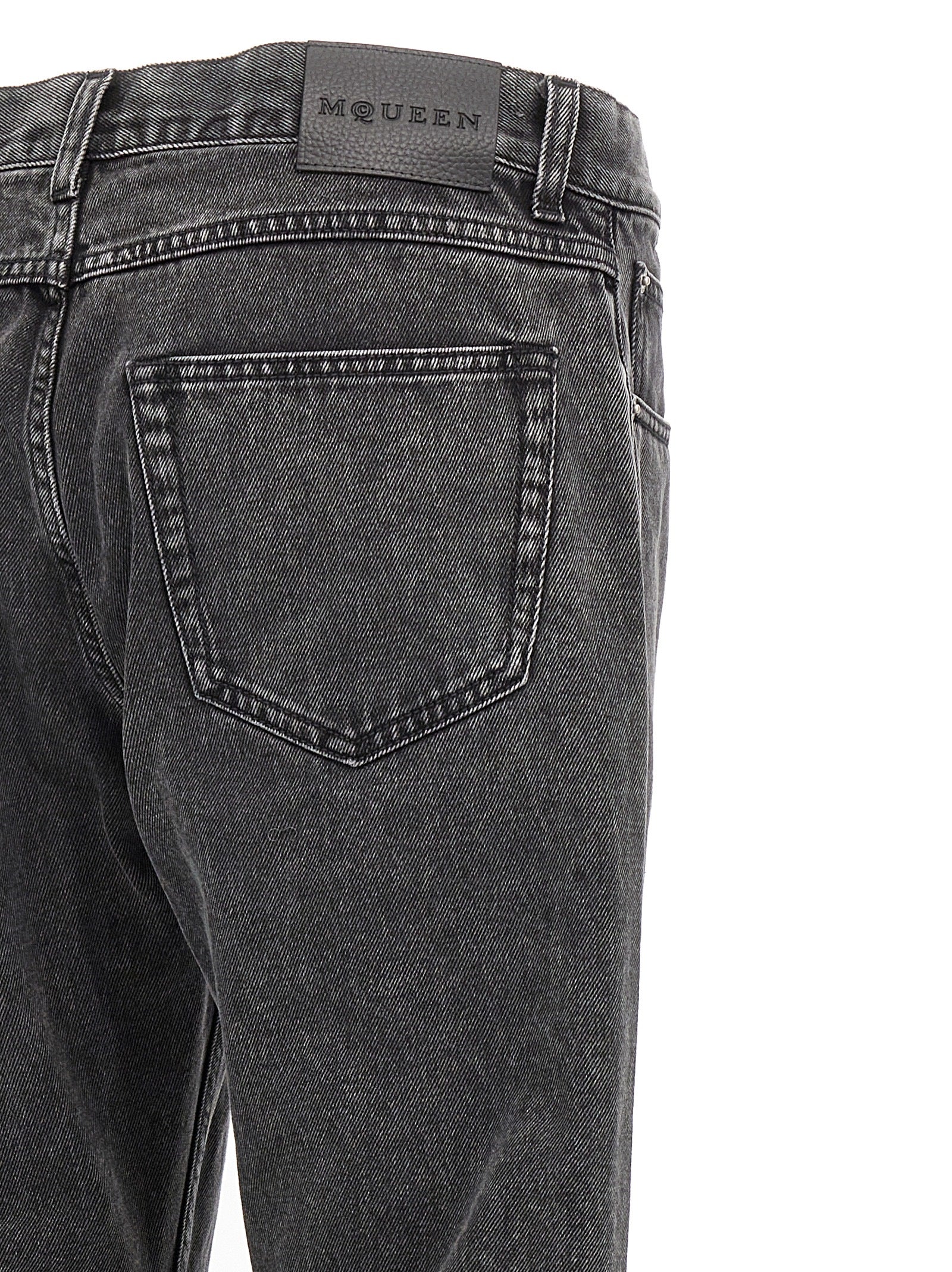 Jeans by Alexander McQueen for men in denim cotton black presents a tailored silhouette, showcasing a tailored straight-leg and long cut with a refined for a truly tailored aesthetic.