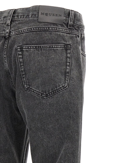 Jeans by Alexander McQueen for men in denim cotton black presents a tailored silhouette, showcasing a tailored straight-leg and long cut with a refined for a truly tailored aesthetic.