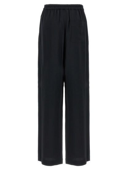 Chinos Pants by Moschino for women in acetate & viscose black features an utilitarian-chic silhouette, showcasing a utilitarian-chic with a long cut and for a refined look.
