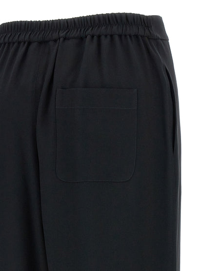 Chinos Pants by Moschino for women in acetate & viscose black features an perennial and long, expertly tailored with a perennial for a refined silhouette.