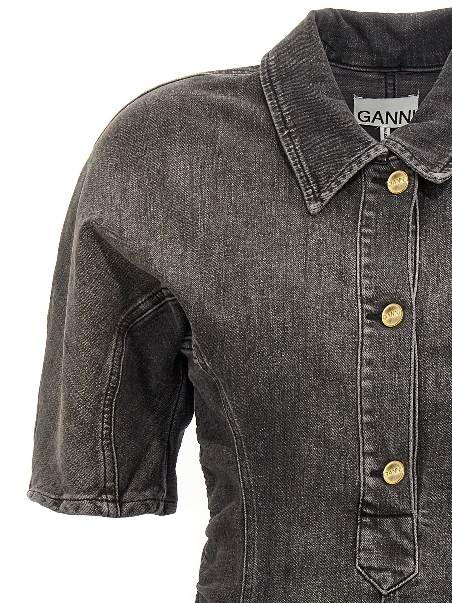 Dress by Ganni for women in stretch denim cotton black features an cute silhouette, detailed with a and that elegantly flows into a cute short.