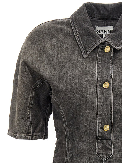 Dress by Ganni for women in stretch denim cotton black features an cute silhouette, detailed with a and that elegantly flows into a cute short.