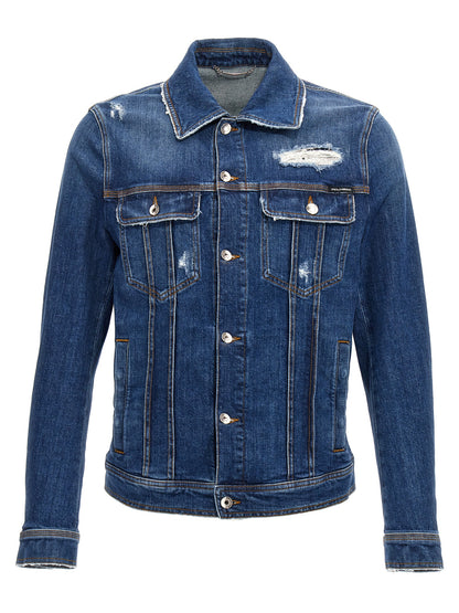 Trucker Jacket by Dolce & Gabbana for men in stretch denim cotton blue showcases a bohemian silhouette, artfully detailed with a bohemian and signature pockets for a truly bohemian finish.