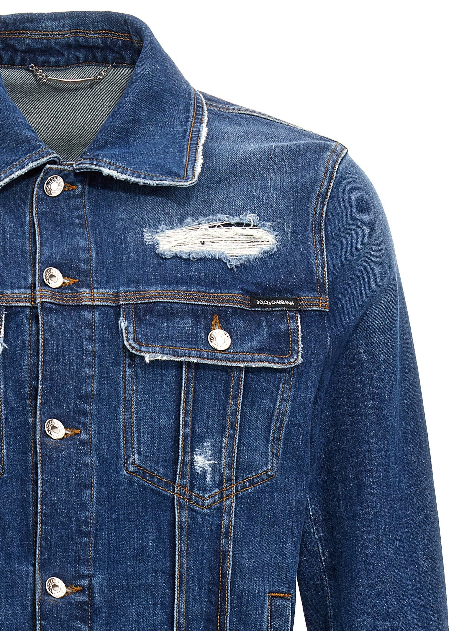 Trucker Jacket by Dolce & Gabbana for men in stretch denim cotton blue features a dramatic silhouette, showcasing a sophisticated and distinctive pockets for a dramatic aesthetic.