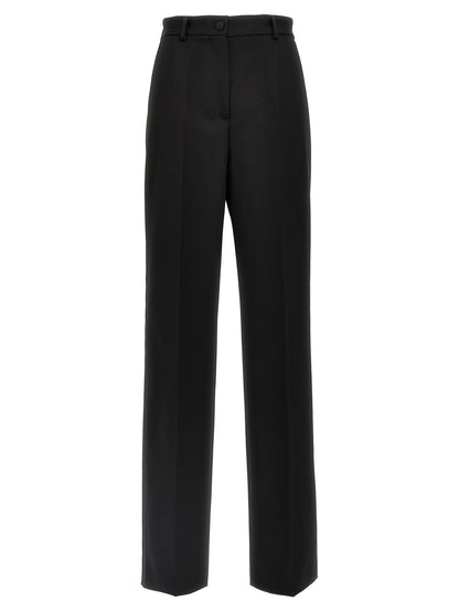 Trousers by Dolce & Gabbana for women in virgin wool polyester & silk black presents a smart silhouette, meticulously detailed with a smart , a smart long, and a smart high rise.