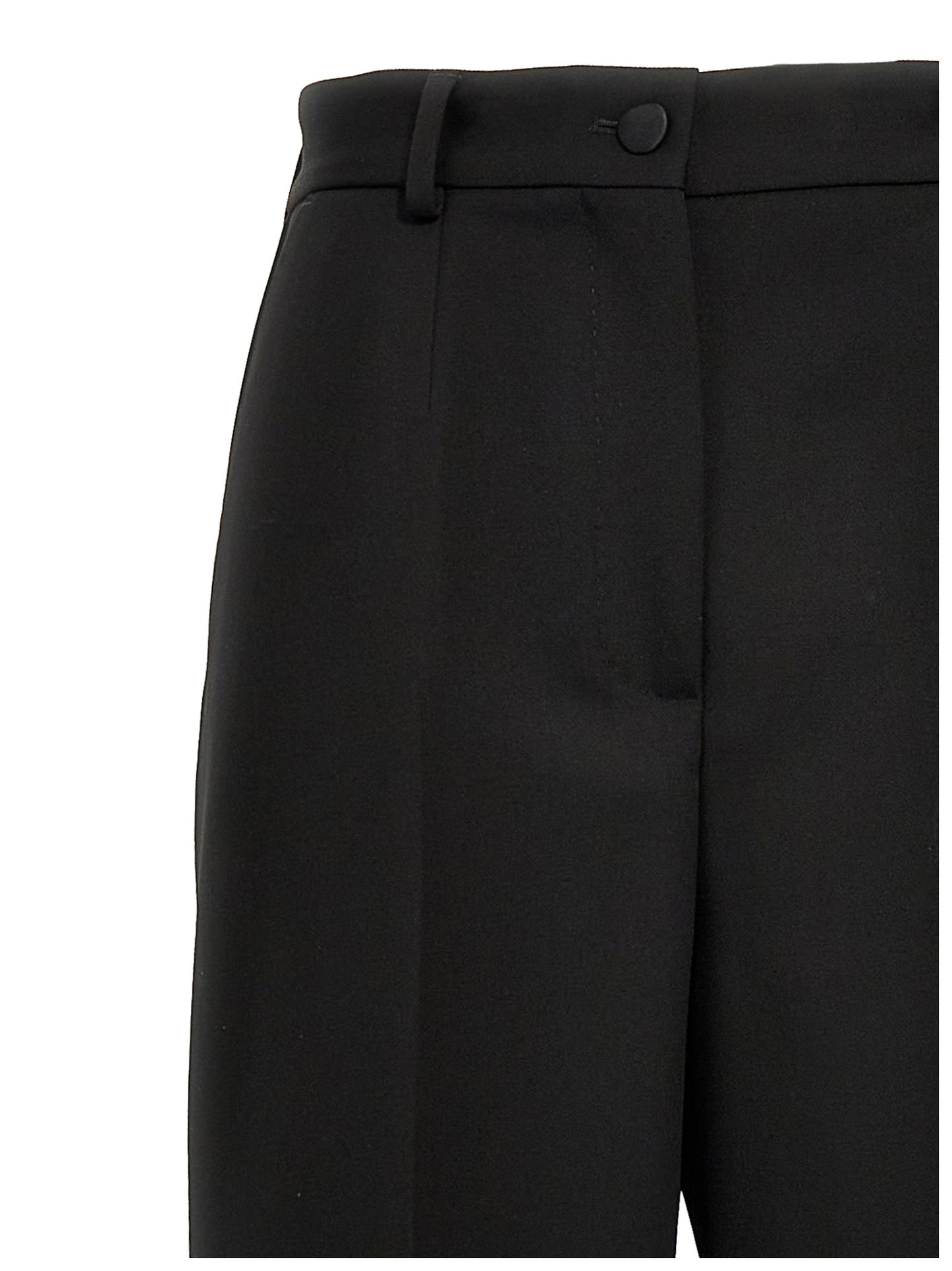 Trousers by Dolce & Gabbana for women in virgin wool polyester & silk black features an sartorial silhouette, showcasing a precise and long with a sartorial high rise for a refined look.