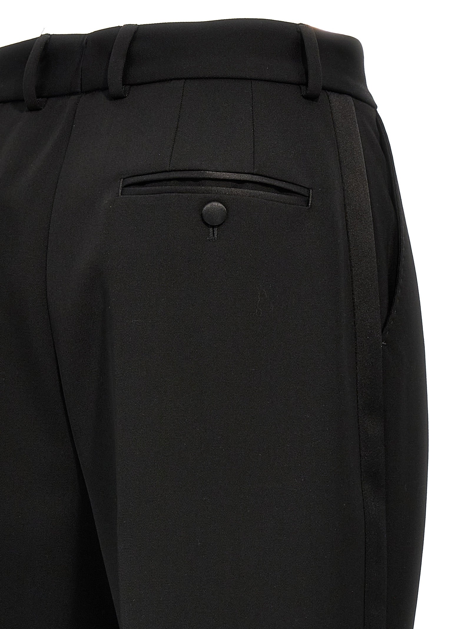 Trousers by Dolce & Gabbana for women in virgin wool polyester & silk black features a artisanal silhouette, showcasing a sophisticated with a long and high rise for a artisanal finish.