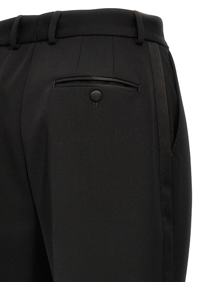 Trousers by Dolce & Gabbana for women in virgin wool polyester & silk black features a artisanal silhouette, showcasing a sophisticated with a long and high rise for a artisanal finish.