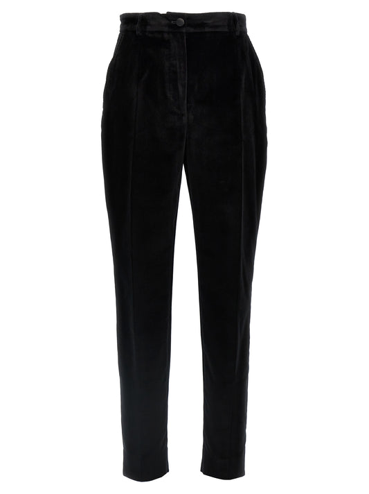 Trousers by Dolce & Gabbana for women in polyester cotton & silk black features a artisanal silhouette, showcasing a sophisticated with a long and for a artisanal finish.