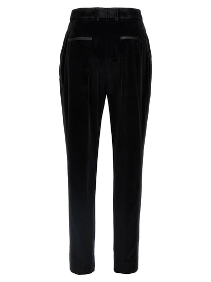 Trousers by Dolce & Gabbana for women in polyester cotton & silk black presents a perennial silhouette, meticulously tailored with a cut, long finish, and an elegant .