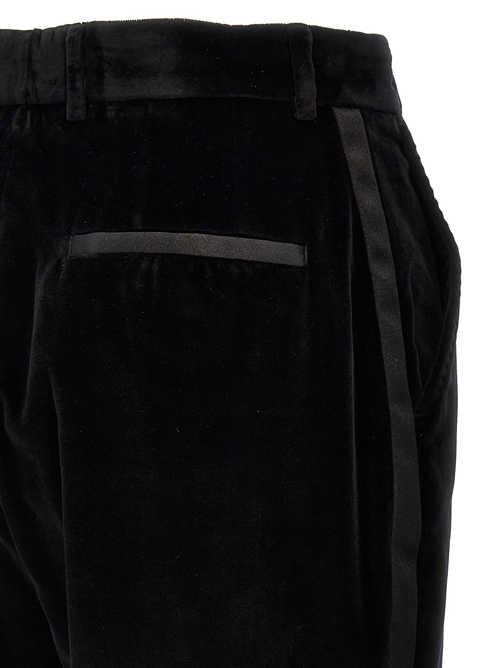 Trousers by Dolce & Gabbana for women in polyester cotton & silk black features an sartorial silhouette, showcasing a precise and long with a sartorial for a refined look.