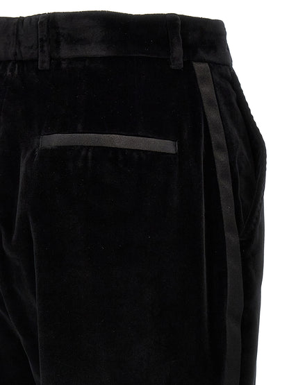 Trousers by Dolce & Gabbana for women in polyester cotton & silk black features an sartorial silhouette, showcasing a precise and long with a sartorial for a refined look.