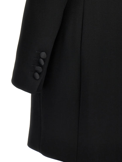 Blazer by Dolce & Gabbana for women in polyester silk & virgin wool black presents a distinguished silhouette, detailed with a distinguished and distinctive for a truly sophisticated finish.
