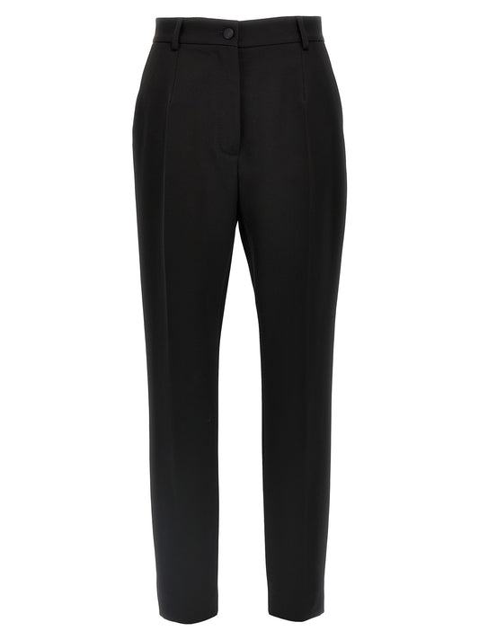 Trousers by Dolce & Gabbana for women in virgin wool polyester & silk black features a artisanal silhouette, showcasing a sophisticated with a long and high rise for a artisanal finish.