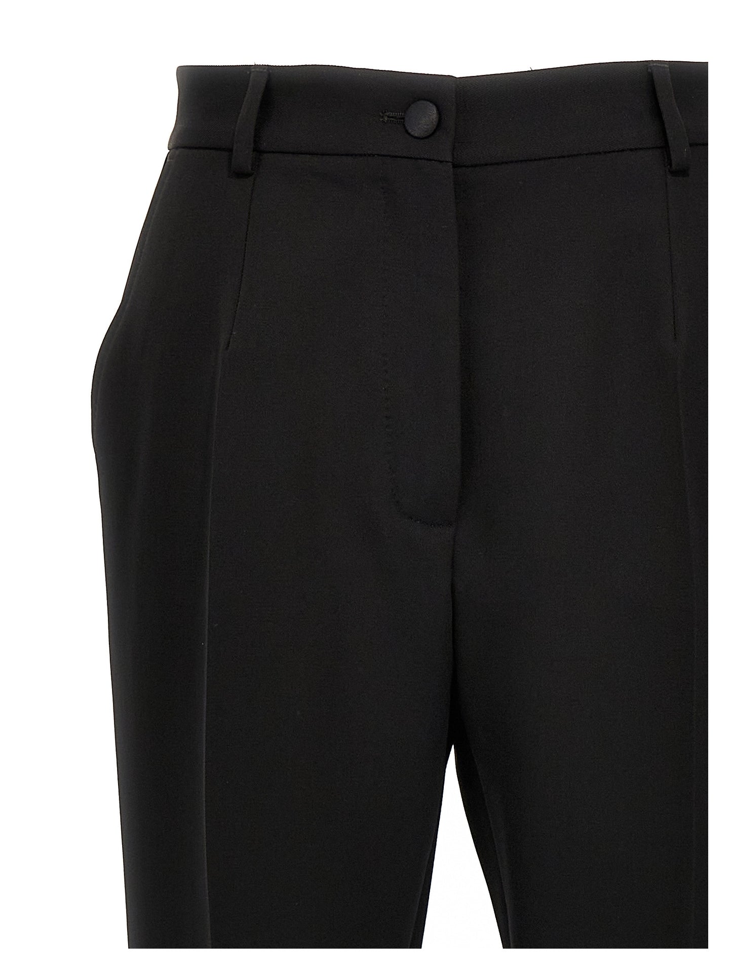 Trousers by Dolce & Gabbana for women in virgin wool polyester & silk black features a tailored silhouette with a tailored , defined by its long and a sophisticated high rise.