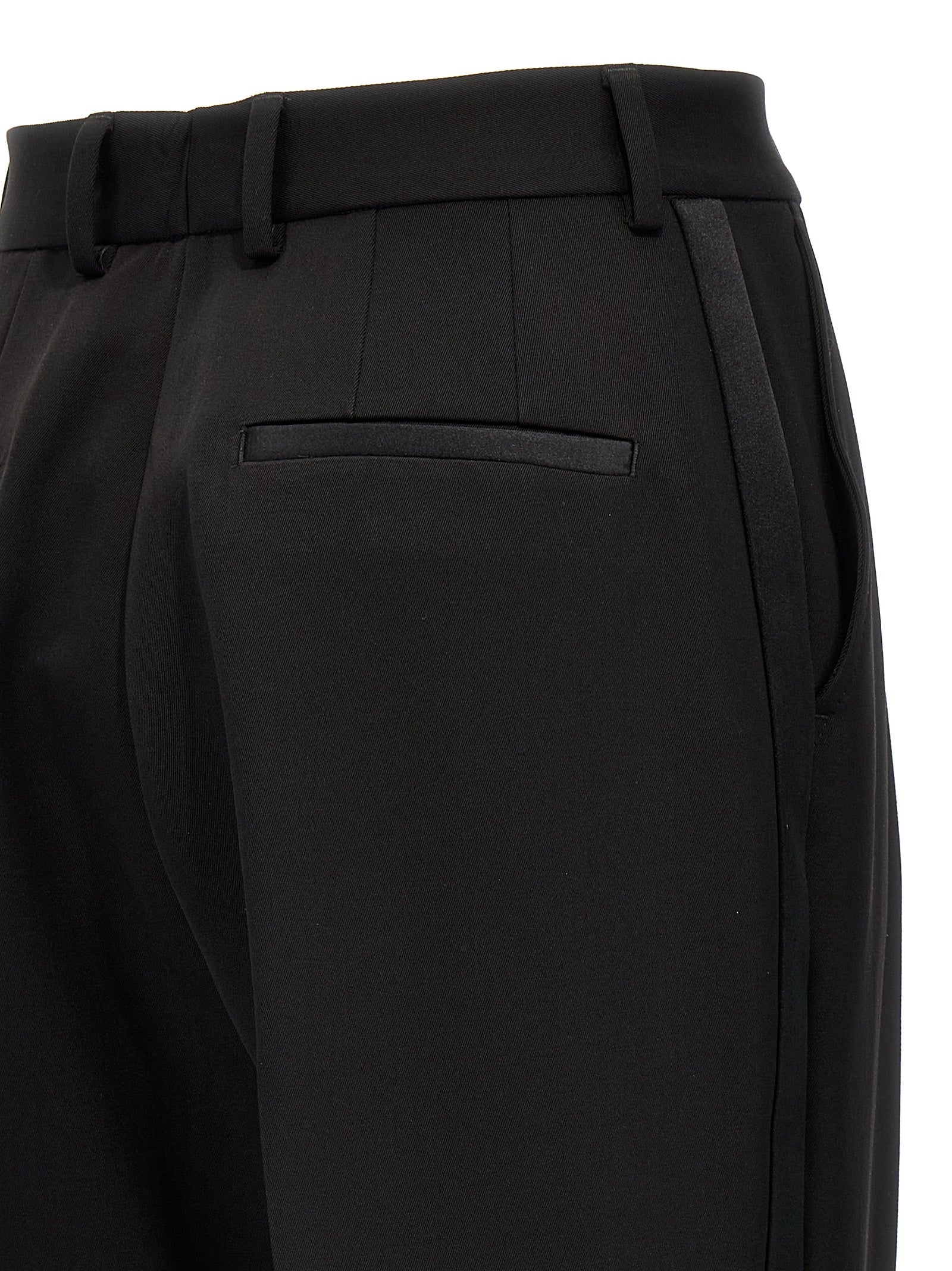 Trousers by Dolce & Gabbana for women in virgin wool polyester & silk black features an on trend silhouette, showcasing a sophisticated with a long and high rise for an on trend finish.