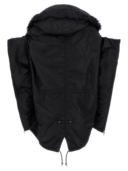 This Hooded Puffer Jacket by Junya Watanabe for women in nylon faux fur black exhibits a edgy silhouette, meticulously detailed with functional pockets, hooded & insulated and a edgy hooded neckline for a edgy finish.