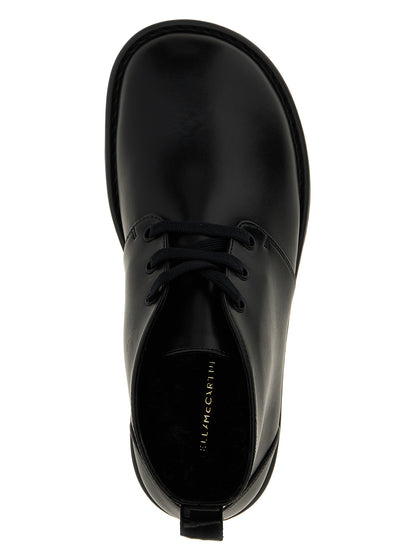 Ankle Chukka-Desert Boots by Stella McCartney for women in polyester polyethylene polyurethane leather black features an avant-garde Women's Polyester Polyethylene Polyurethane Leather Ankle Chukka-Desert Boots silhouette, defined by a sophisticated and a avant-garde .
