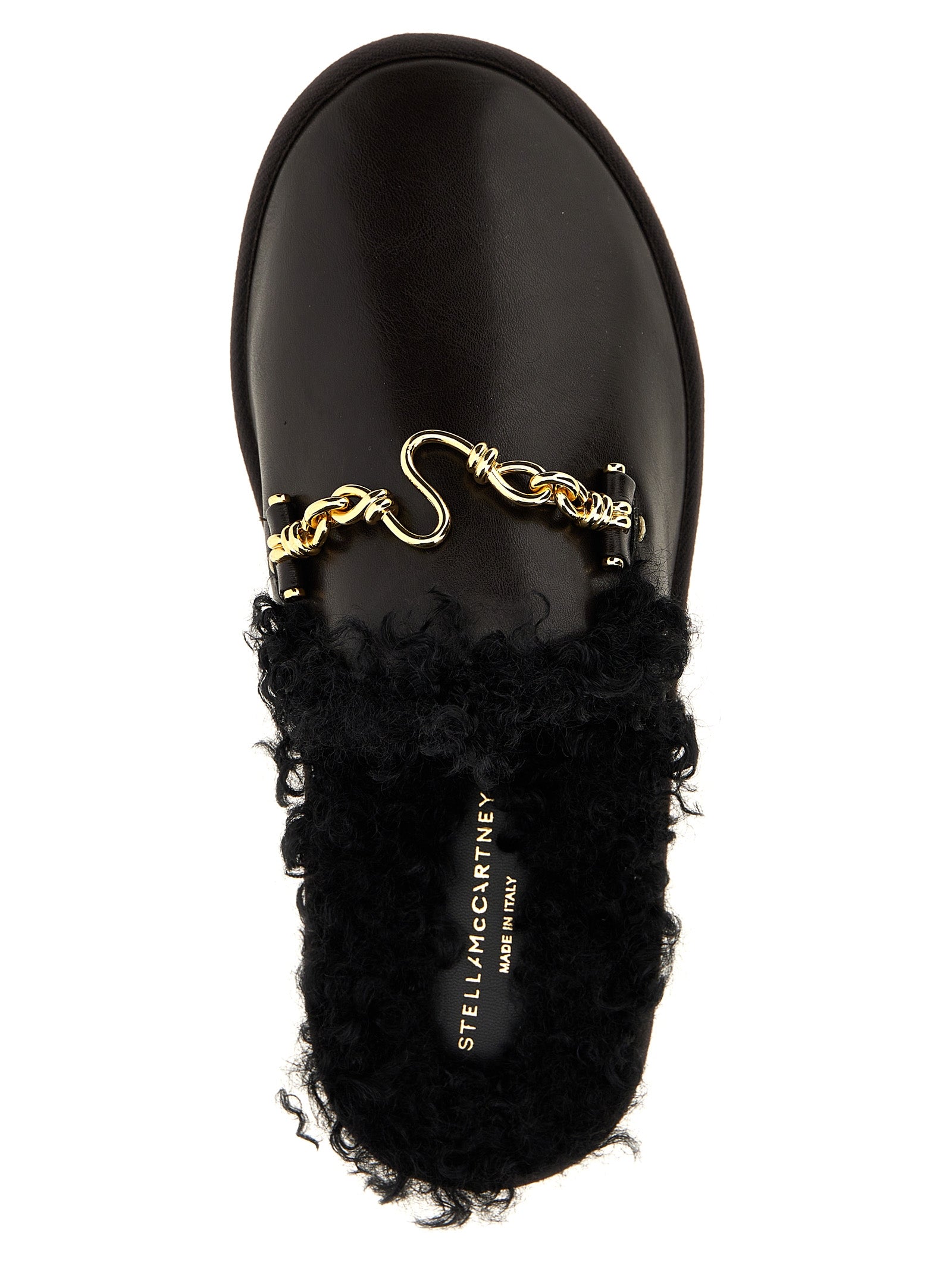 Mules Flat Shoes by Stella McCartney for women in polyethylene polyurethane leather brown features an captivating silhouette, showcasing the captivating style of the Ryder Women's Polyethylene Polyurethane Leather Mules Flat Shoes with its distinct and refined .