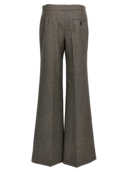 Trousers by Stella McCartney for women in wool gray & houndstooth features a tailored silhouette with a tailored flared, defined by its long and a sophisticated .