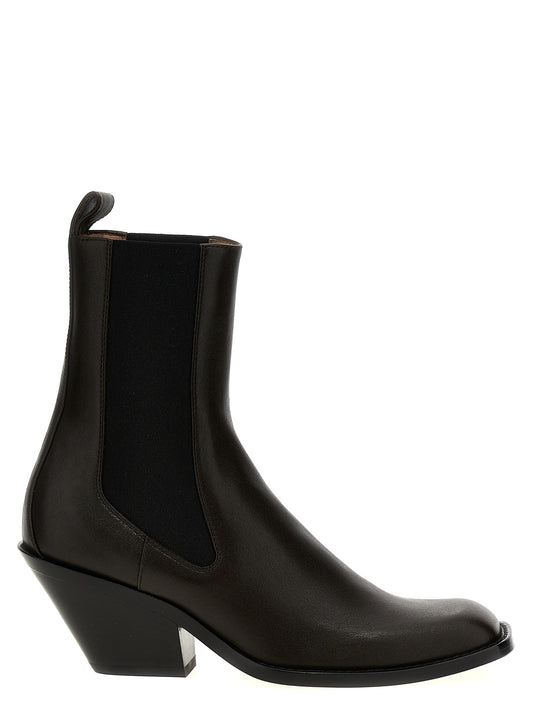 Ankle Chelsea Strap Boots by Khaite for women in bos taurus calfskin leather brown features an avant-garde Women's Bos Taurus Calfskin Leather Ankle Chelsea Strap Boots silhouette, defined by a sophisticated and a avant-garde square toe style.