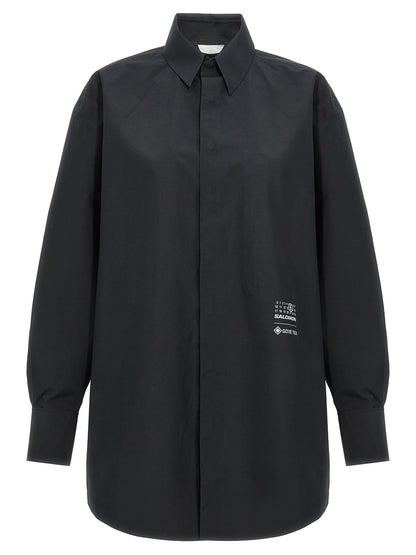 Blouse by MM6 Maison Margiela for women in polyester black showcases a sleek silhouette, elegantly detailed with a sleek and for a sleek finish.