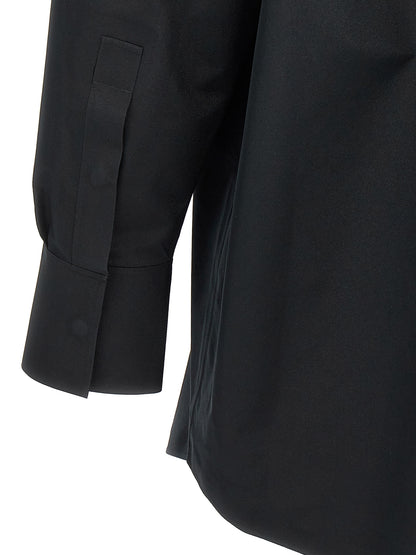 Blouse by MM6 Maison Margiela for women in polyester black showcases a sublime silhouette, artfully detailed with a sublime and for a sophisticated, sublime finish.