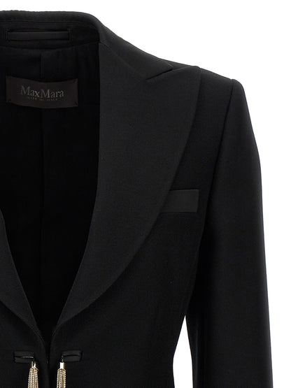 This Blazer by Max Mara for women in virgin wool black presents a tailored silhouette, meticulously tailored with a tailored and distinctive for a tailored finish.
