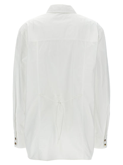Blouse by Ganni for women in organic cotton white presents a discerning silhouette, showcasing a sophisticated and for a truly discerning finish.