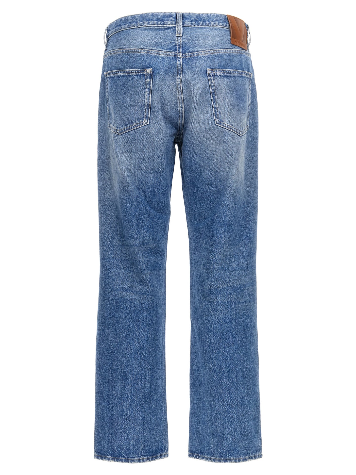 Jeans by Valentino Garavani for men in cotton denim blue presents a refined pantology silhouette, artfully defined by a refined pantology straight-leg, long, and a sophisticated high rise.