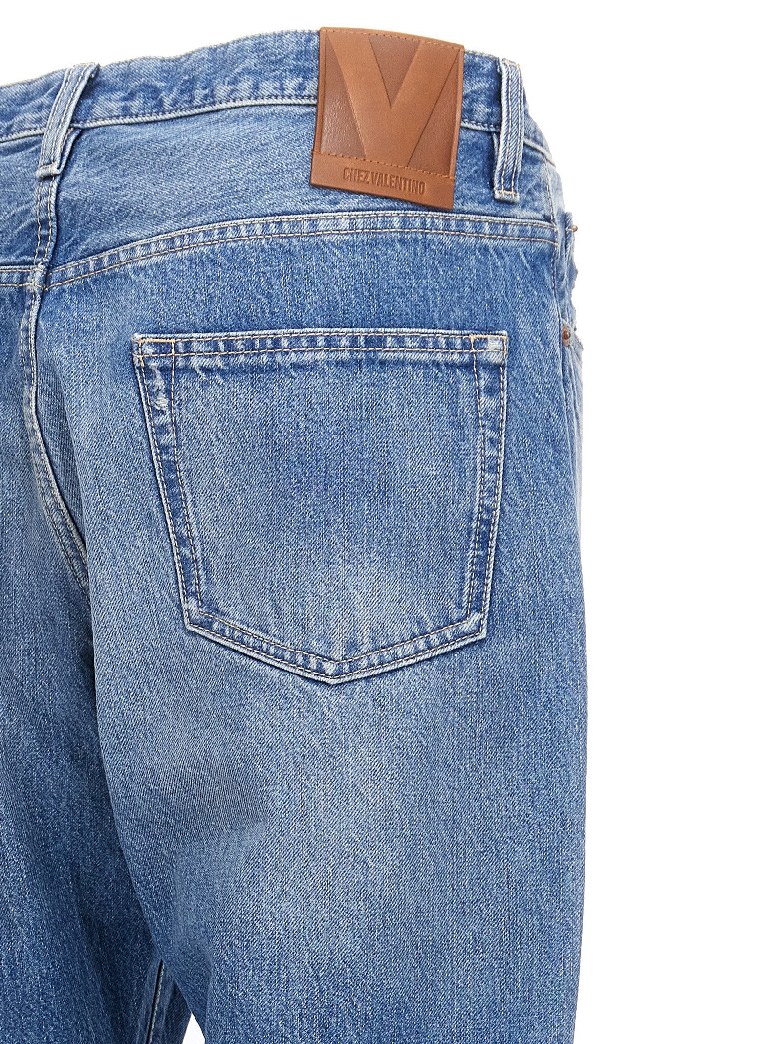 Jeans by Valentino Garavani for men in cotton denim blue presents a tailored silhouette, showcasing a tailored straight-leg and long cut with a refined high rise for a truly tailored aesthetic.