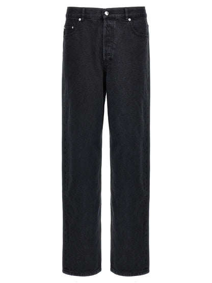 Jeans by A.P.C. for men in denim cotton black presents a tailored silhouette, showcasing a tailored straight-leg & wide and long cut with a refined high rise for a truly tailored aesthetic.