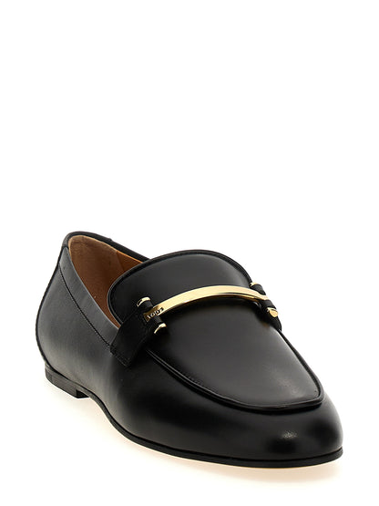 Flat Loafer Slip-On Shoes by Tod's for women in calfskin leather black features an ergonomic silhouette, perfectly showcasing Women's Calfskin Leather Flat Loafer Slip-On Shoes with its distinct flat and elegant .