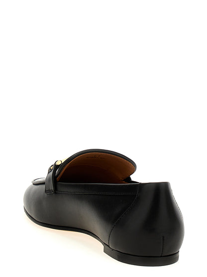 Flat Loafer Slip-On Shoes by Tod's for women in calfskin leather black showcases a resplendent Women's Calfskin Leather Flat Loafer Slip-On Shoes aesthetic, defined by its resplendent and elegant flat.
