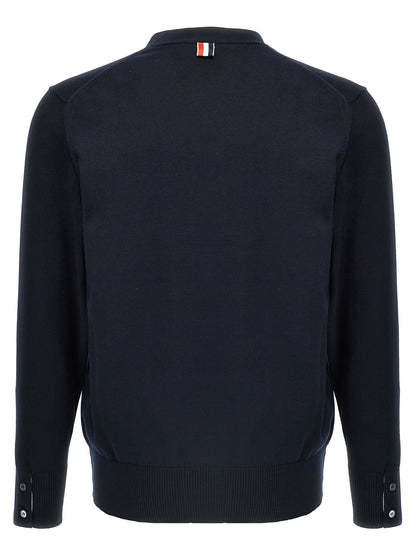 Cardigan by Thom Browne for men in cotton blue & signature presents a textural silhouette, artfully finished with a textural v-neck neckline and for a sophisticated, textural look.
