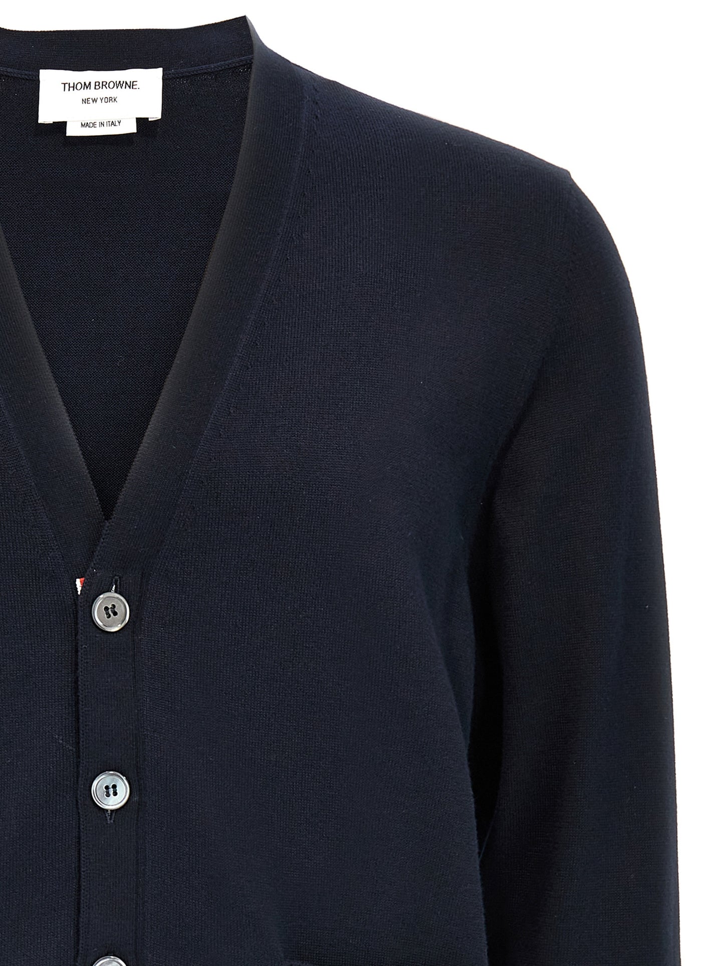 Cardigan by Thom Browne for men in cotton blue & signature showcases a captivating silhouette, artfully detailed with a captivating and v-neck neckline for a truly sophisticated captivating look.