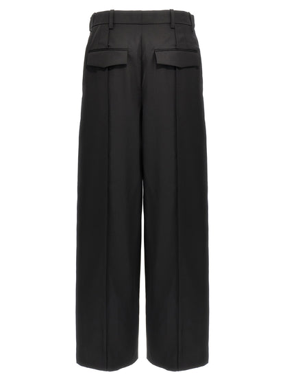 Trousers by Wardrobe.Nyc for women in wool black presents a smart silhouette, meticulously detailed with a smart straight, a smart long, and a smart high rise.
