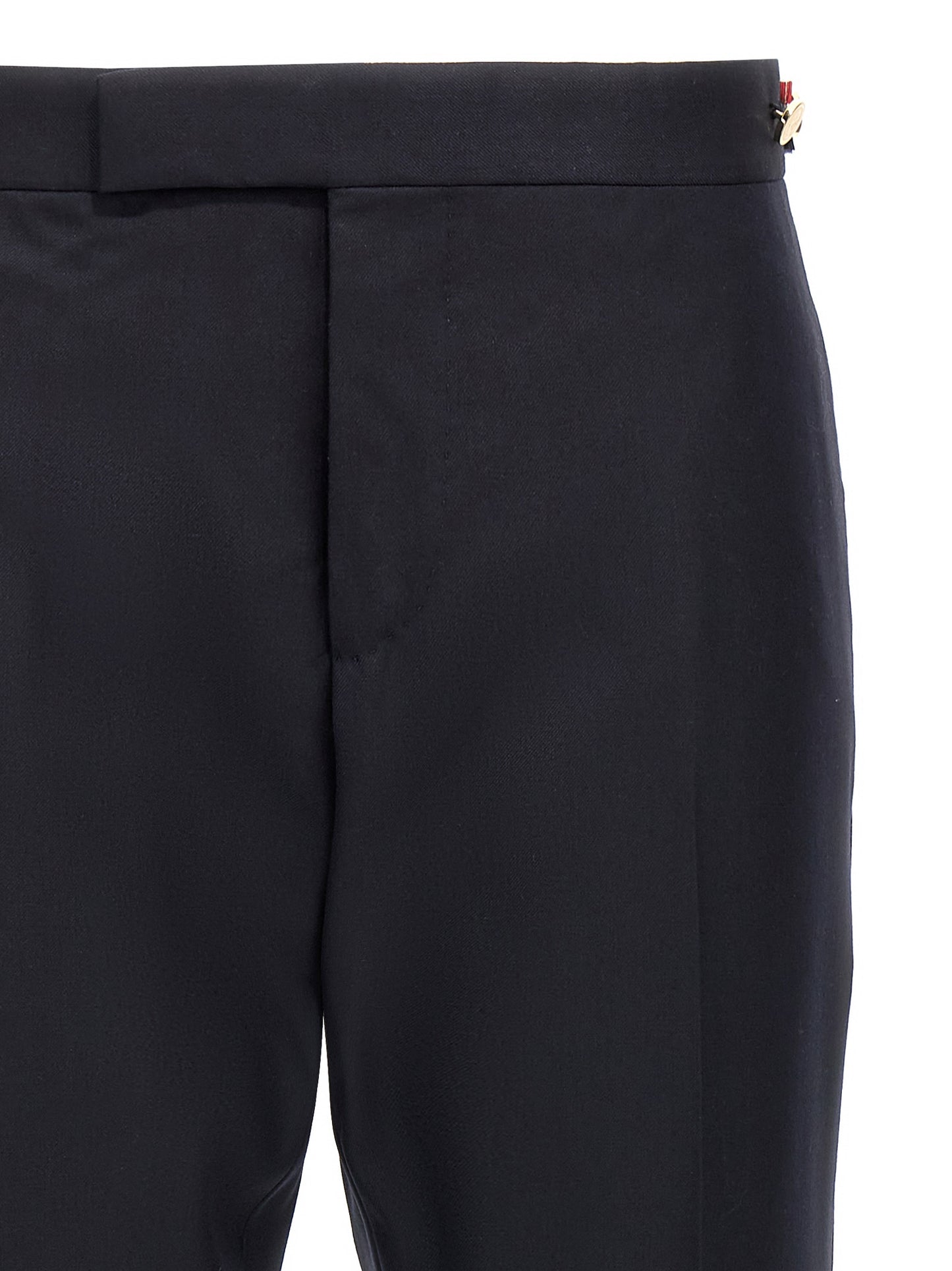 Trousers by Thom Browne for men in wool twill blue presents a smart silhouette, meticulously detailed with a smart straight-leg, a smart long, and a smart low rise.