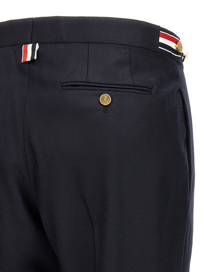 Trousers by Thom Browne for men in wool twill blue presents a perennial silhouette, meticulously tailored with a straight-leg cut, long finish, and an elegant low rise.