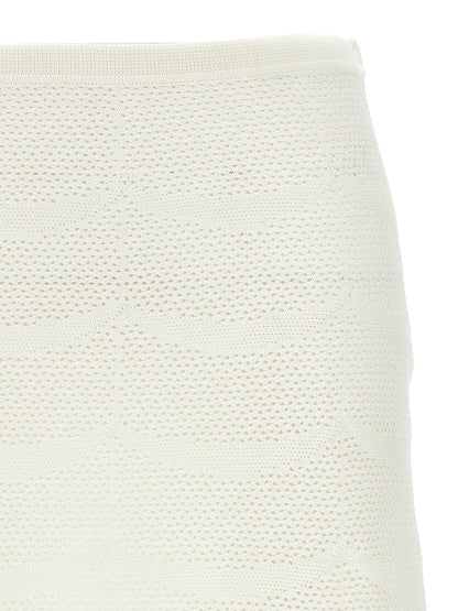 Skirt by Tom Ford for women in cotton & silk white features an tailored silhouette, artfully capturing the essence of Crochet Women's Cotton & Silk Mini Long Skirt in a sophisticated mini long.