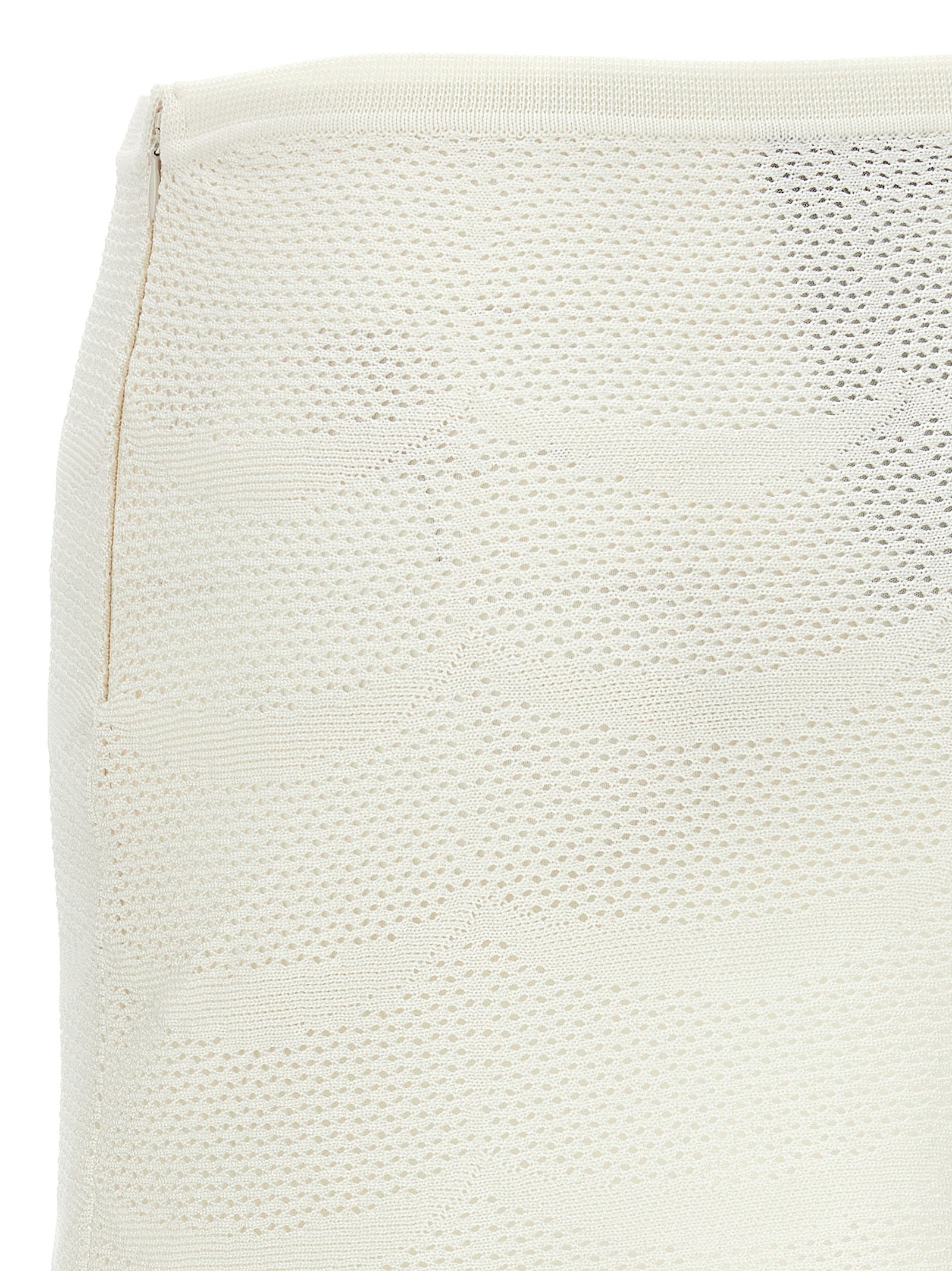 Skirt by Tom Ford for women in cotton & silk white showcases a sultry silhouette, elegantly defined by its mini long and the sophisticated sultry design of the Crochet Women's Cotton & Silk Mini Long Skirt.