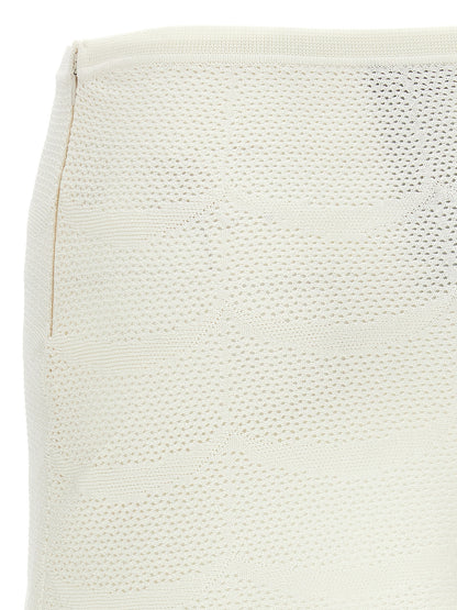 Skirt by Tom Ford for women in cotton & silk white showcases a sultry silhouette, elegantly defined by its mini long and the sophisticated sultry design of the Crochet Women's Cotton & Silk Mini Long Skirt.
