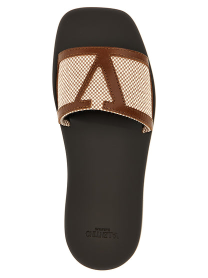 Sliders Sandals Flat Shoes by Valentino Garavani for women in cotton canvas & leather brown features an statuesque silhouette from the V Logo Women's Cotton Canvas & Leather Sliders Sandals Flat Shoes collection, showcasing a and a statuesque for a statuesque look.
