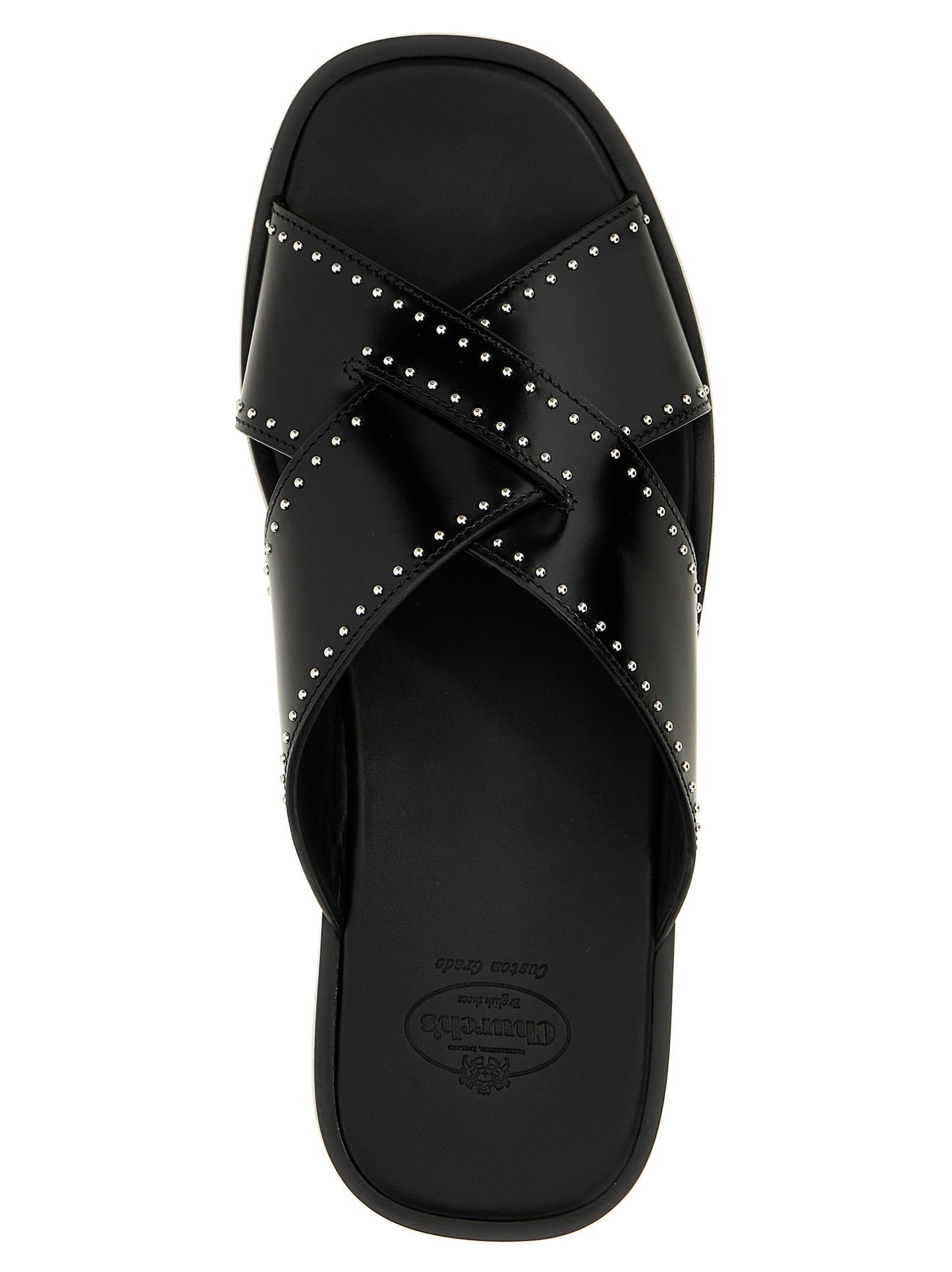 Sliders Sandals Flat Shoes by Church's for women in bos taurus calf leather black features an statuesque silhouette from the Women's Bos Taurus Calf Leather Sliders Sandals Flat Shoes collection, showcasing a and a statuesque for a statuesque look.