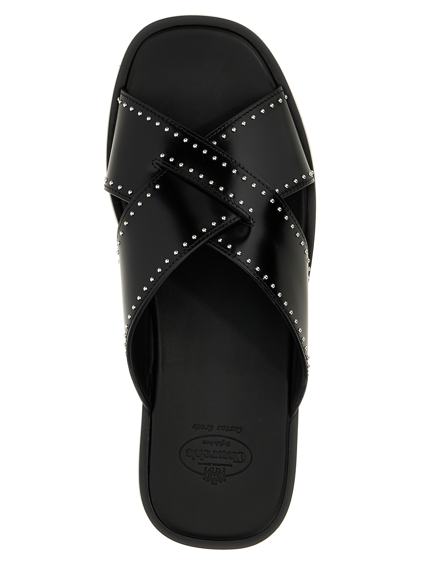 Sliders Sandals Flat Shoes by Church's for women in bos taurus calf leather black features an statuesque silhouette from the Women's Bos Taurus Calf Leather Sliders Sandals Flat Shoes collection, showcasing a and a statuesque for a statuesque look.