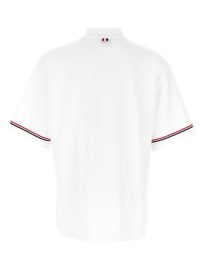 Polo Shirt by Thom Browne for men in cotton white presents a sleek silhouette, featuring a refined and for a sleek finish.
