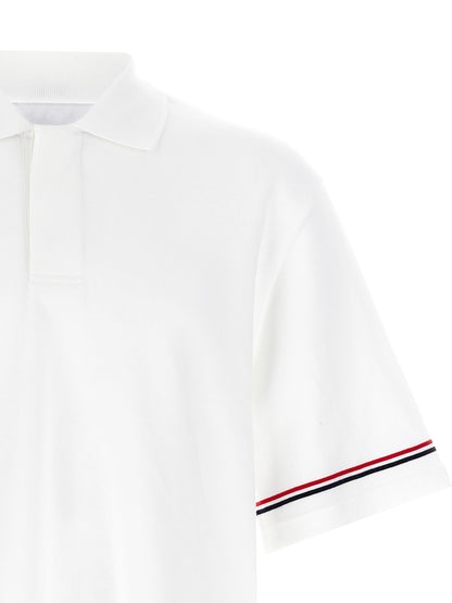 This Polo Shirt by Thom Browne for men in cotton white presents a flawless silhouette, showcasing flawless detailing and a refined for a truly flawless aesthetic.