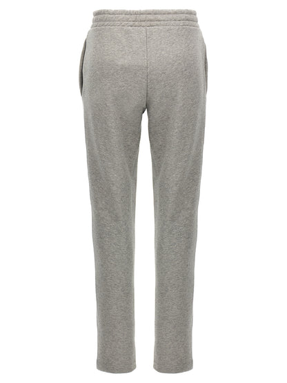 Joggers by The Attico for women in cotton gray presents a tailored silhouette, showcasing a tailored straight-leg and long cut with a refined for a truly tailored aesthetic.