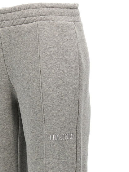 Joggers by The Attico for women in cotton gray presents a refined pantology silhouette, artfully defined by a refined pantology straight-leg, long, and a sophisticated .